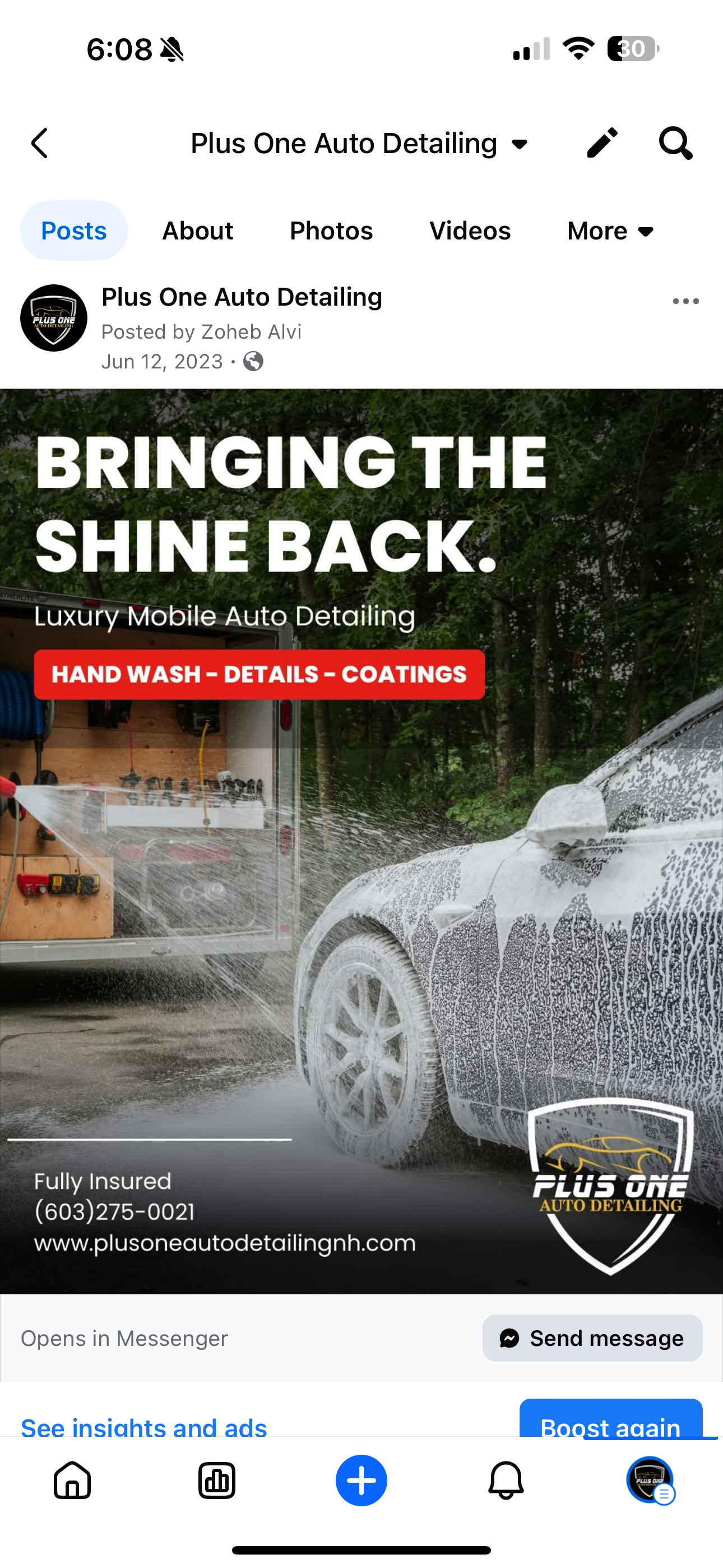 Foam-covered vehicle being professionally washed